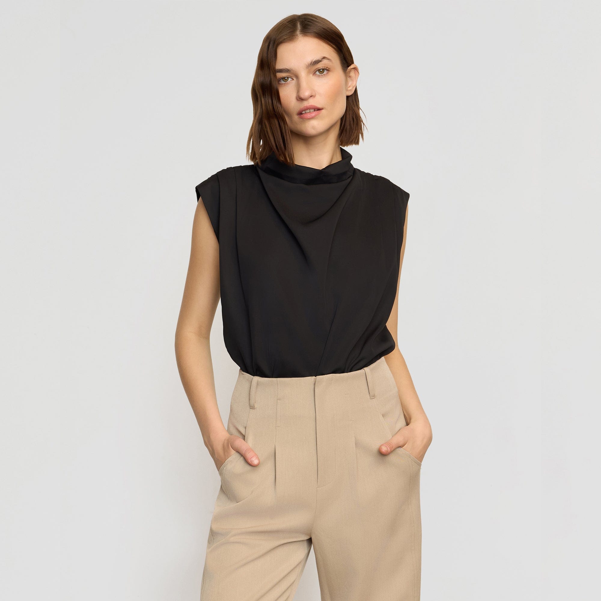 black high neck sleeveless blouse